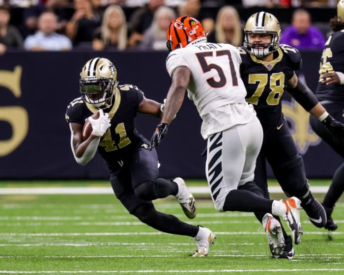 New Orleans Saints running back Alvin Kamara (41) rushes against Cincinnati Bengals linebacker Germaine Pratt (57). Mandatory Credit: Stephen Lew-USA TODAY Sports